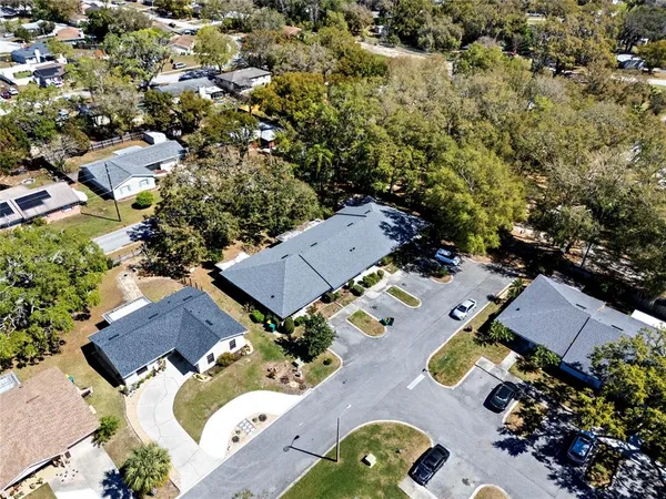 an aerial view of a house with yard