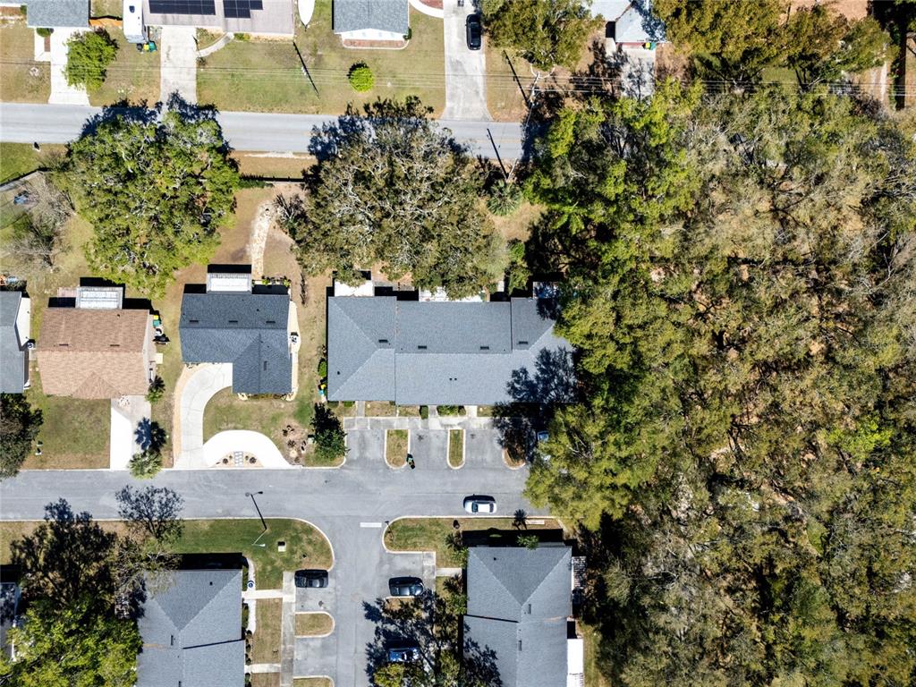 2723 Beacon Street Eustis, FL 32726 - Photo 35 of 42 an aerial view of multiple houses with yard
