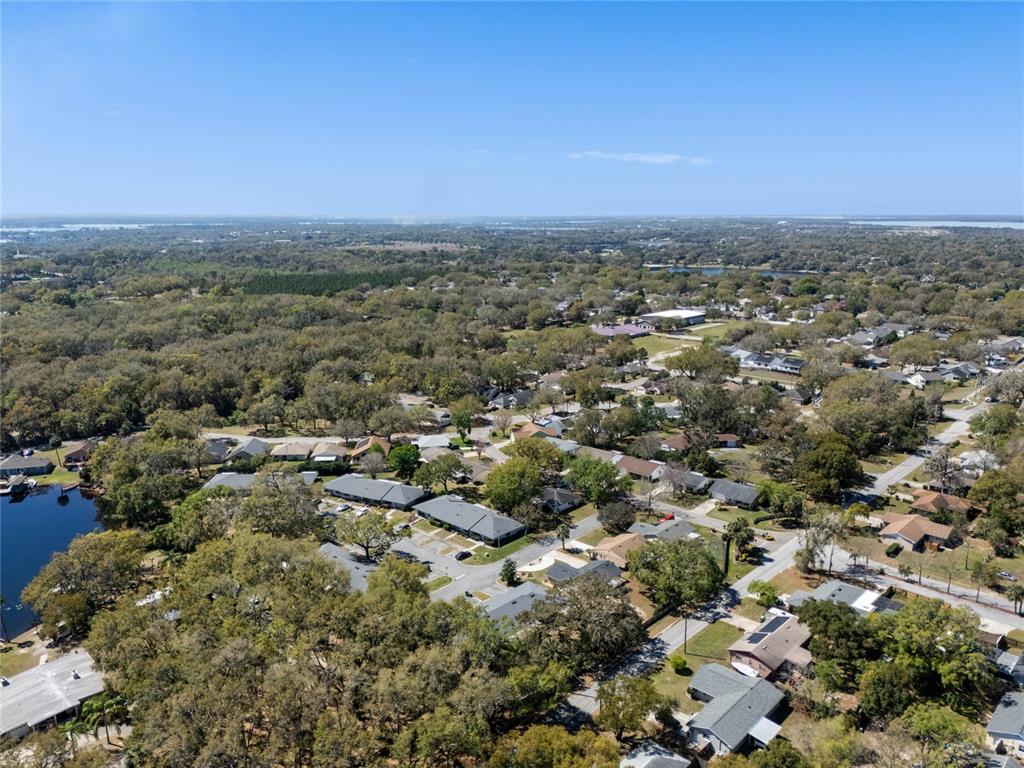 2723 Beacon Street Eustis, FL 32726 - Photo 39 of 42 an aerial view of a city with lots of residential buildings