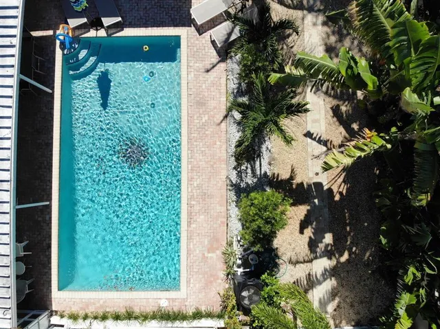 a view of a backyard with a car parked in a yard
