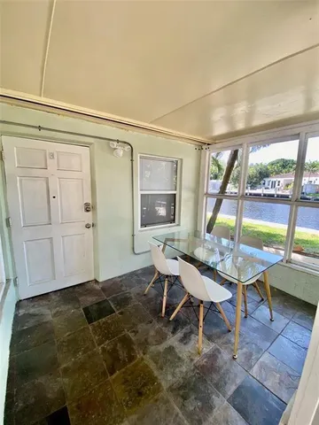 a room with furniture and a large window