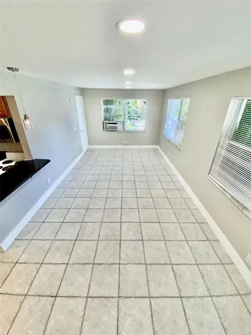 a kitchen with stainless steel appliances granite countertop a sink and a stove