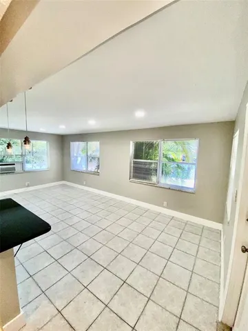 a view of an empty room and window