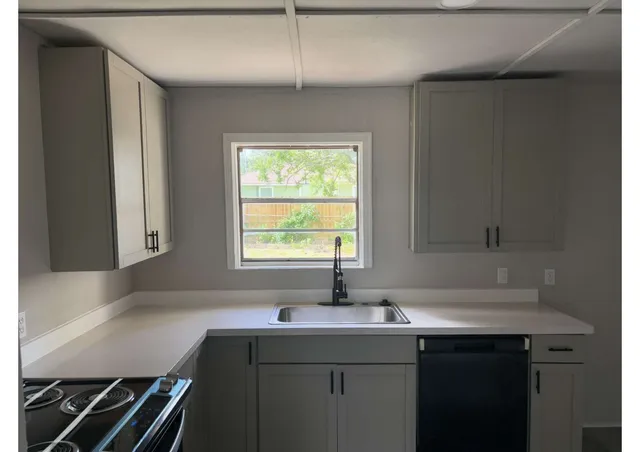 a room with a sink and a window