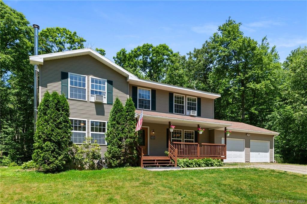853 Pudding Hill Road Hampton, CT 06247 - Photo 1 of 1 front view of a house with a yard