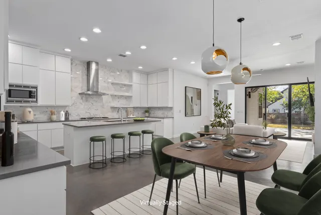 a kitchen with a table and chairs in it