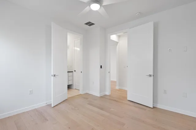 a view of a balcony with wooden floor