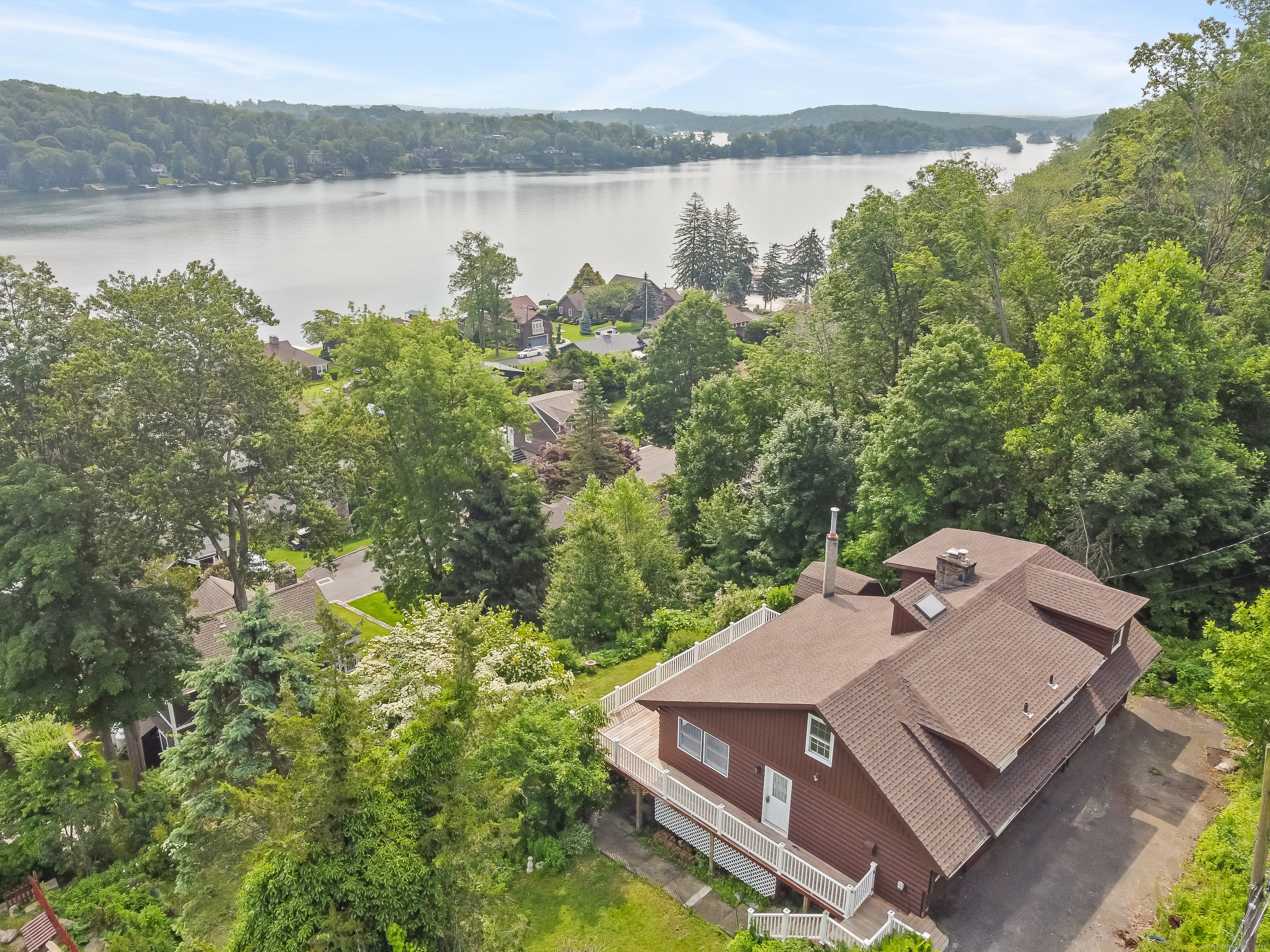 9 Overlook Road New Fairfield, CT 06812 - Photo 1 of 1 a view of a lake with a mountain in the background