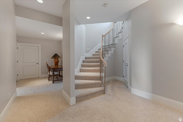 3222 Eagle View Circle Sandy, UT 84092 - Photo 32 of 60 Stairway with carpet floors and recessed lighting