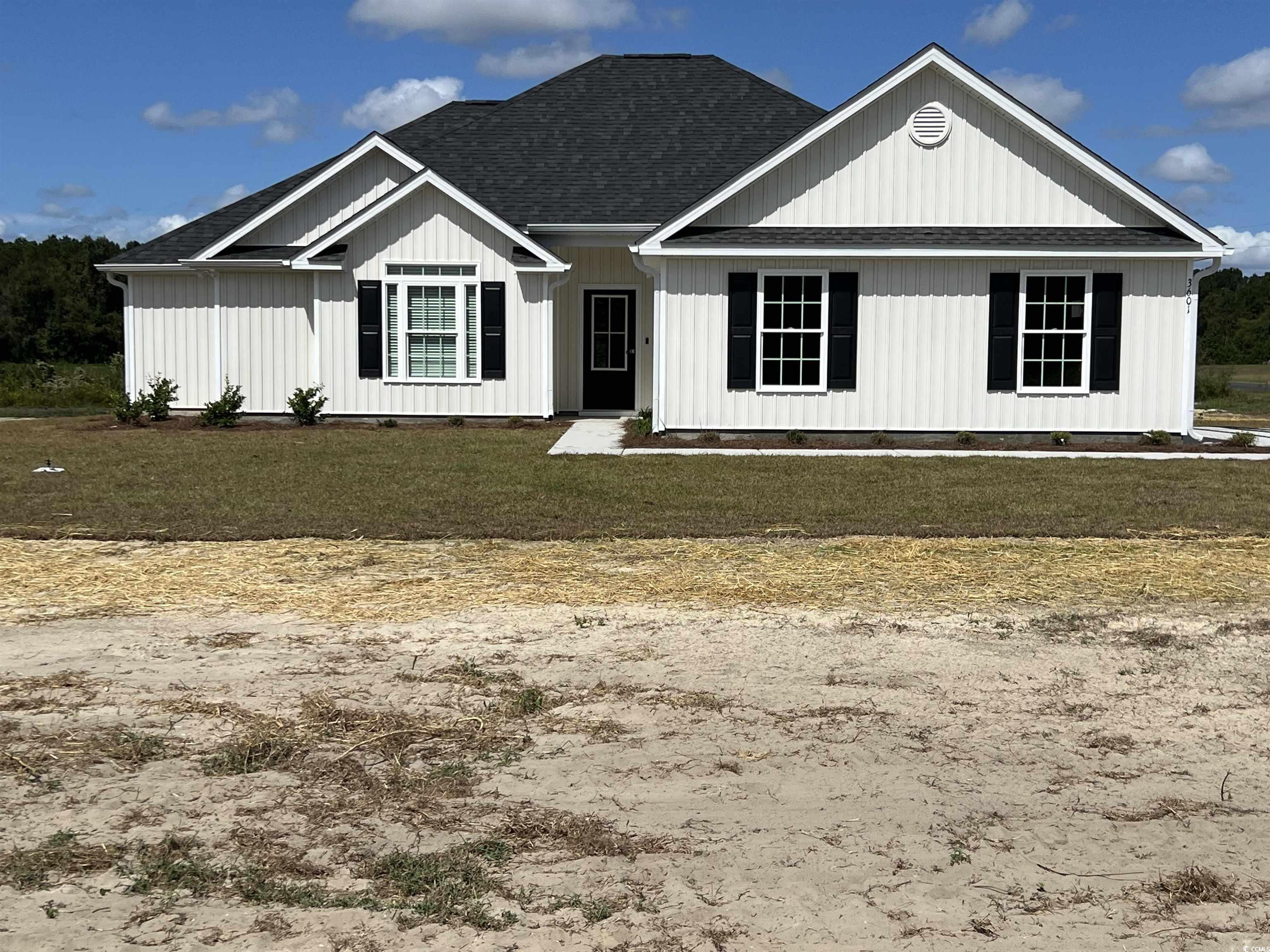 3601 Valley Forge Road Aynor, SC 29511 - Photo 1 of 27 View of front of house featuring a front yard and roof with shingles