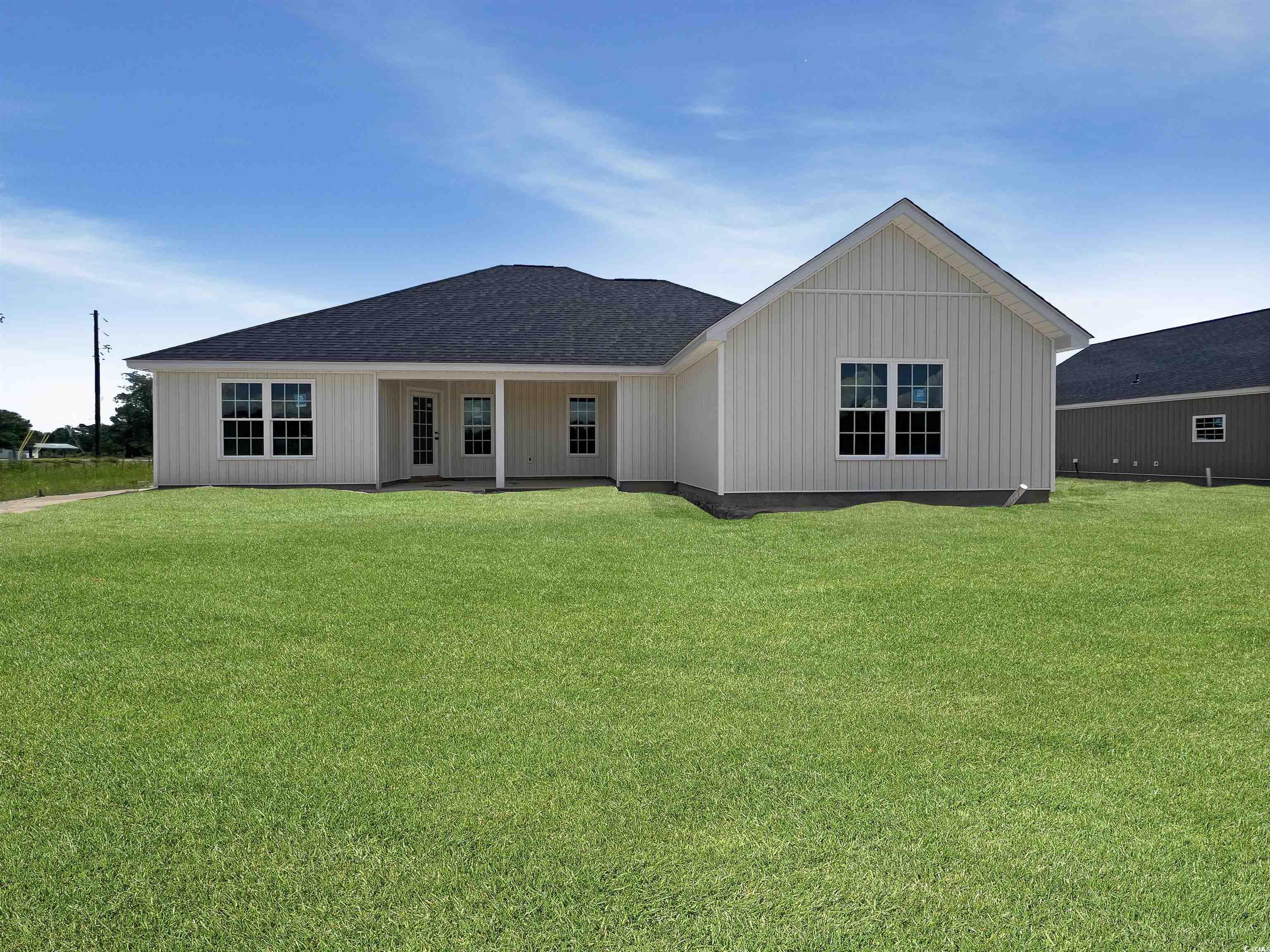 3601 Valley Forge Road Aynor, SC 29511 - Photo 14 of 27 Rear view of house with a lawn and roof with shingles