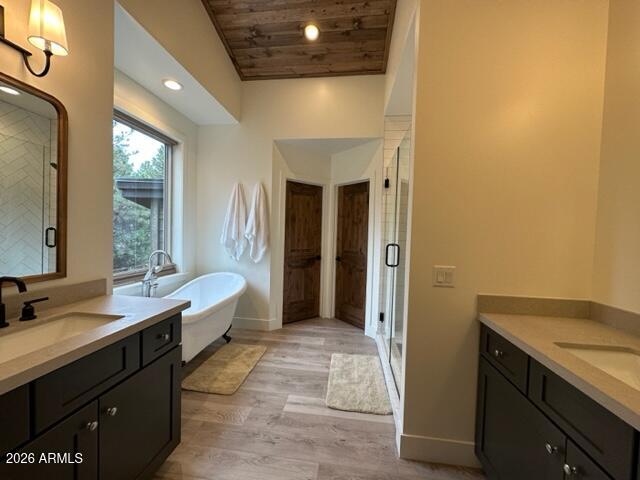 4260 West Falling Leaf Road Show Low, AZ 85901 - Photo 16 of 32 a spacious bathroom with a double vanity sink a mirror and a bathtub
