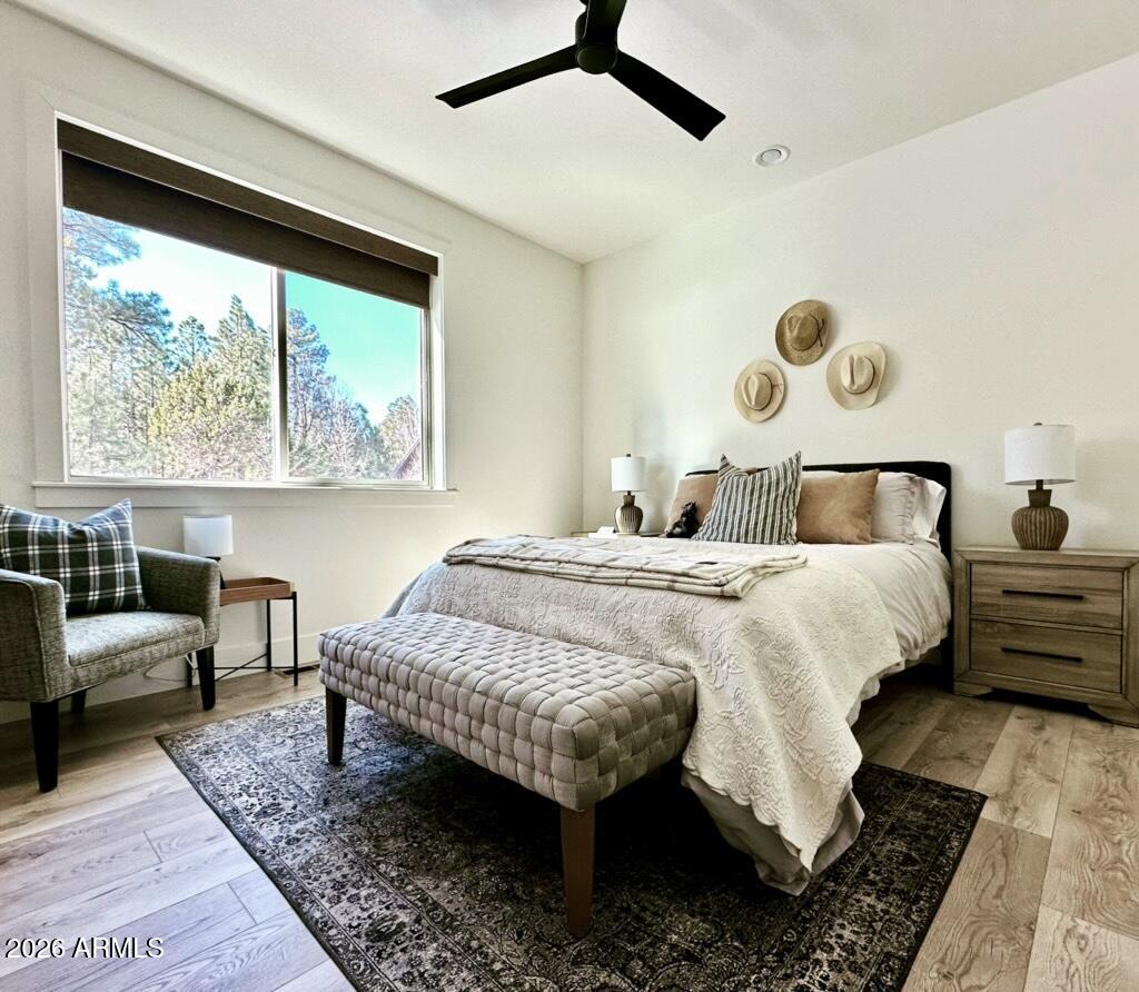 4260 West Falling Leaf Road Show Low, AZ 85901 - Photo 20 of 32 a bedroom with a bed and a large window