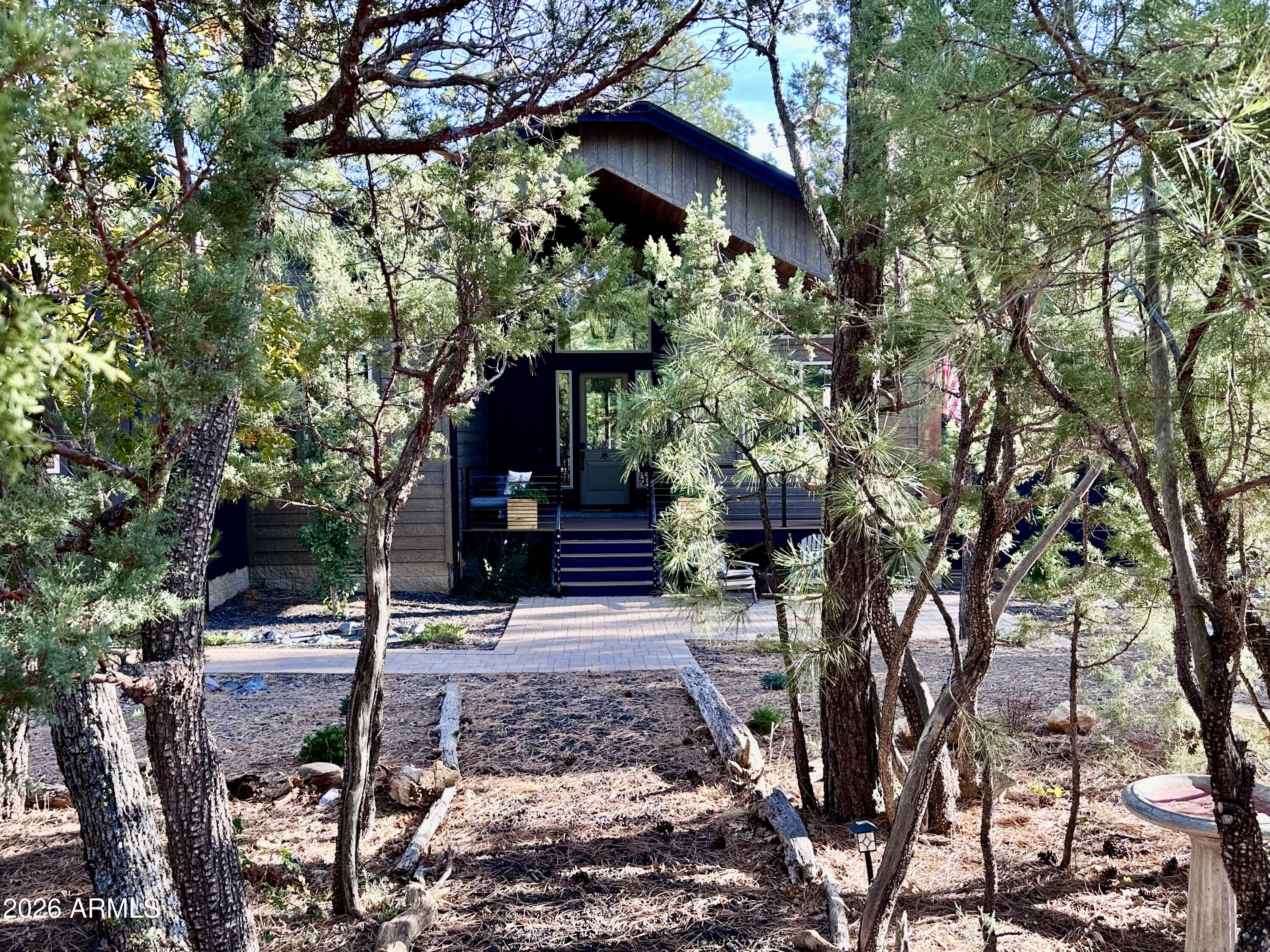 4260 West Falling Leaf Road Show Low, AZ 85901 - Photo 2 of 32 a view of a house with a tree