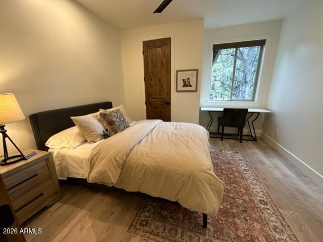 4260 West Falling Leaf Road Show Low, AZ 85901 - Photo 21 of 32 a bedroom with a bed and a window