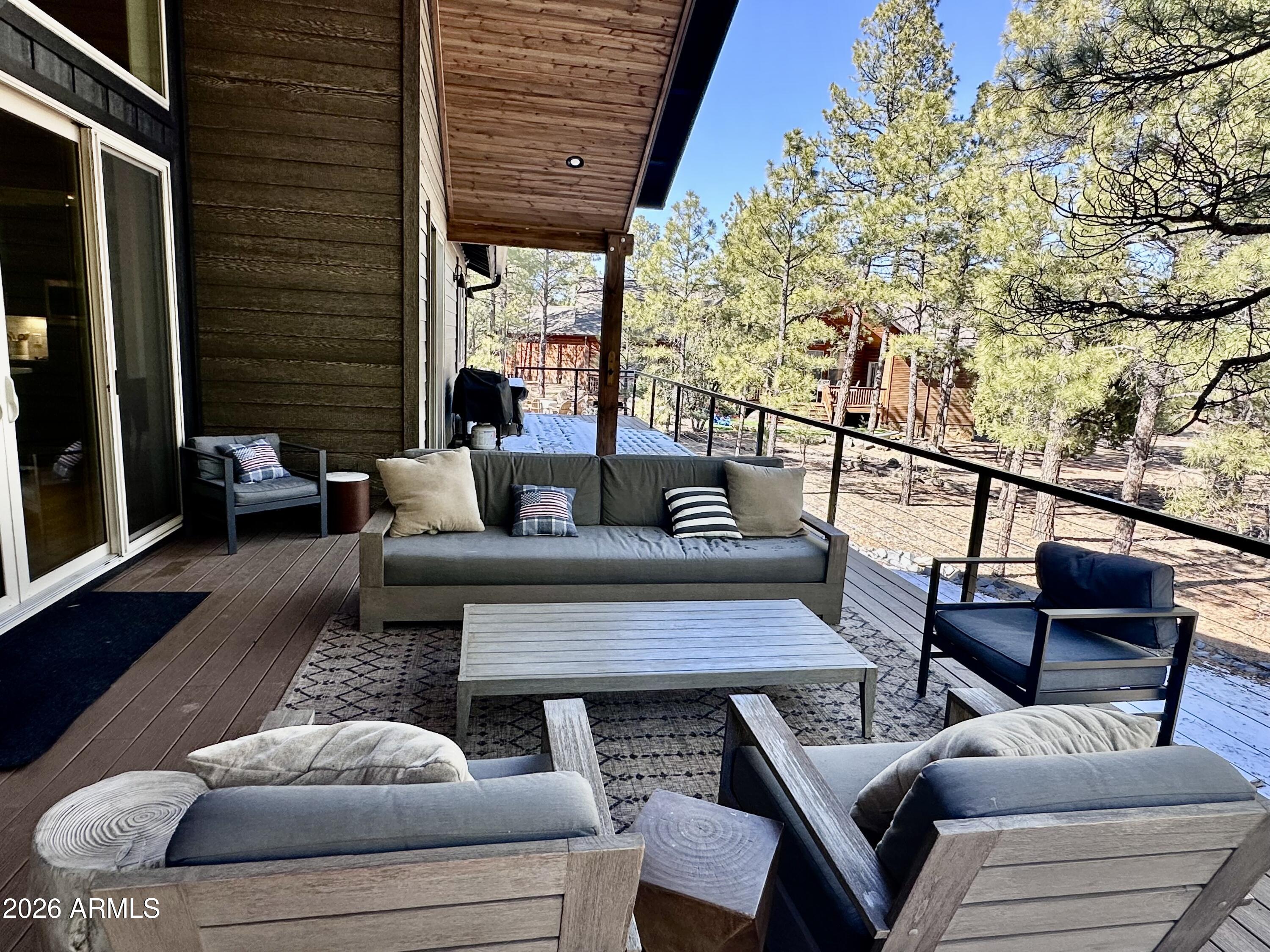 4260 West Falling Leaf Road Show Low, AZ 85901 - Photo 26 of 32 a living room with furniture and a large window