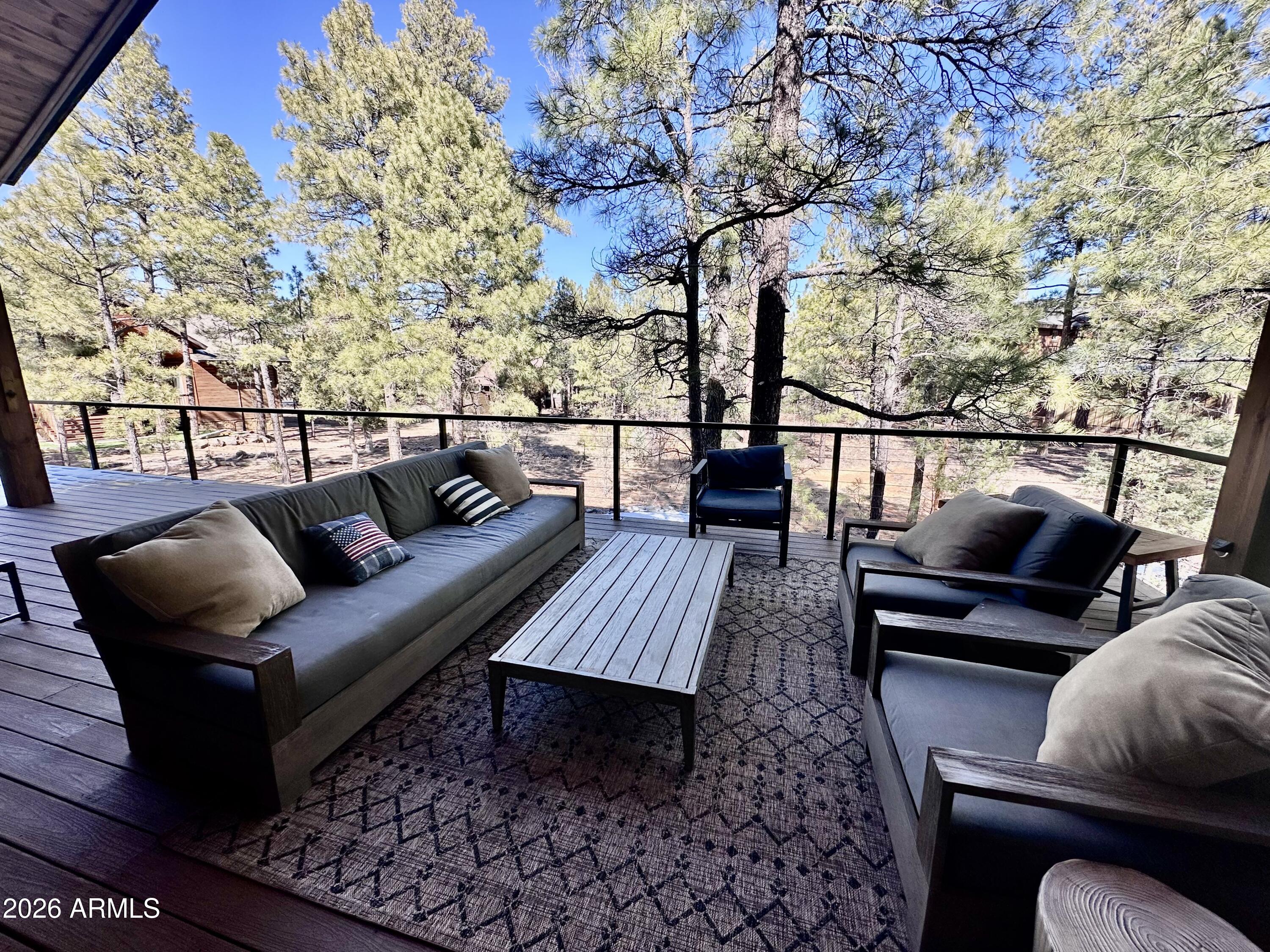 4260 West Falling Leaf Road Show Low, AZ 85901 - Photo 27 of 32 a view of sitting area with furniture and wooden floor