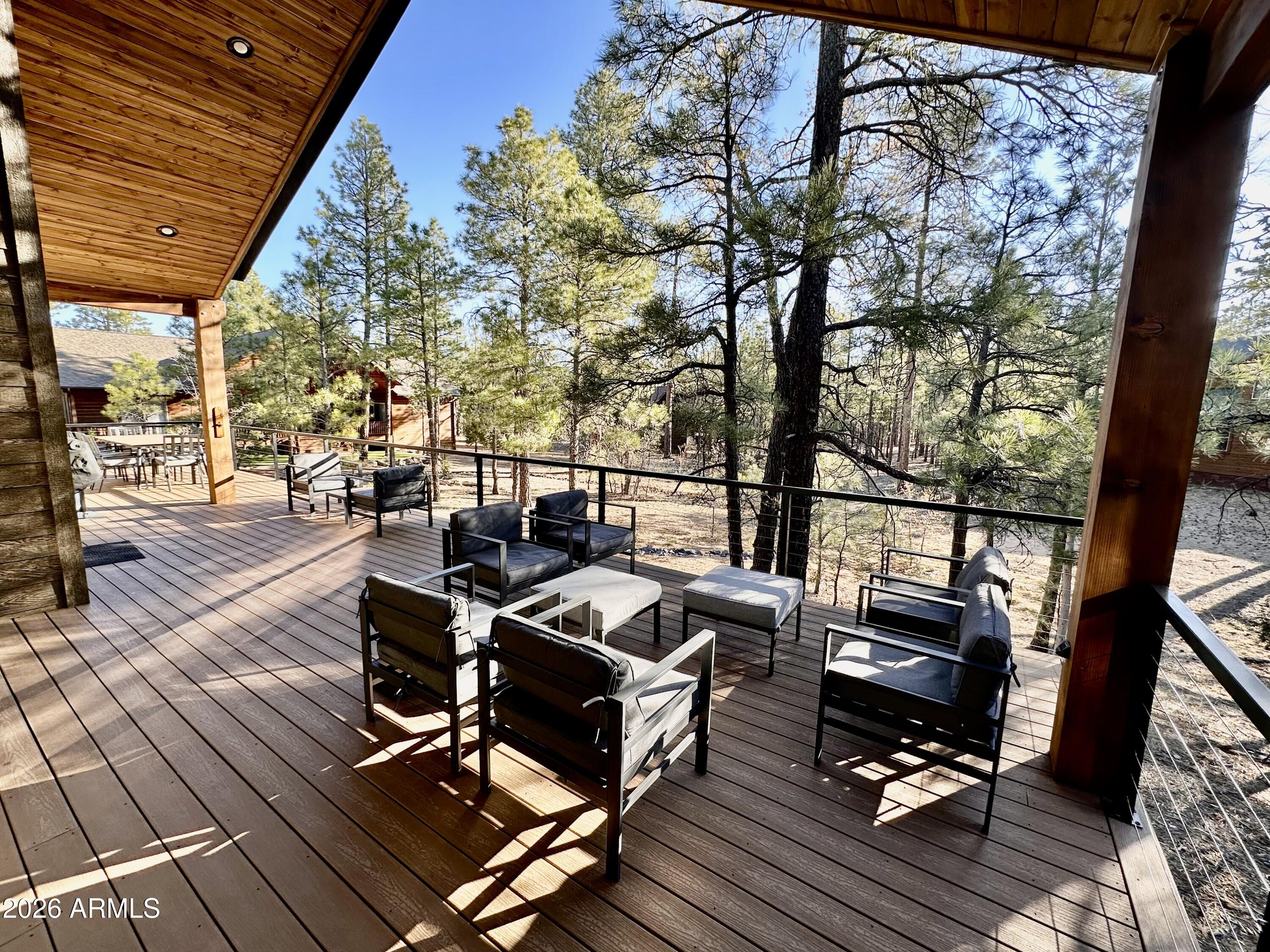 4260 West Falling Leaf Road Show Low, AZ 85901 - Photo 28 of 32 a view of a chairs and table on the wooden floor