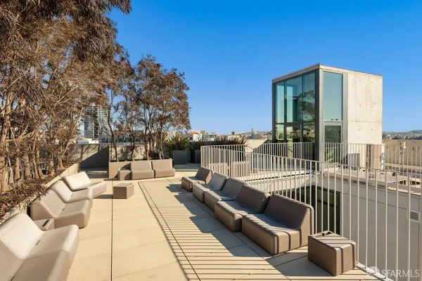 a view of a balcony with furniture