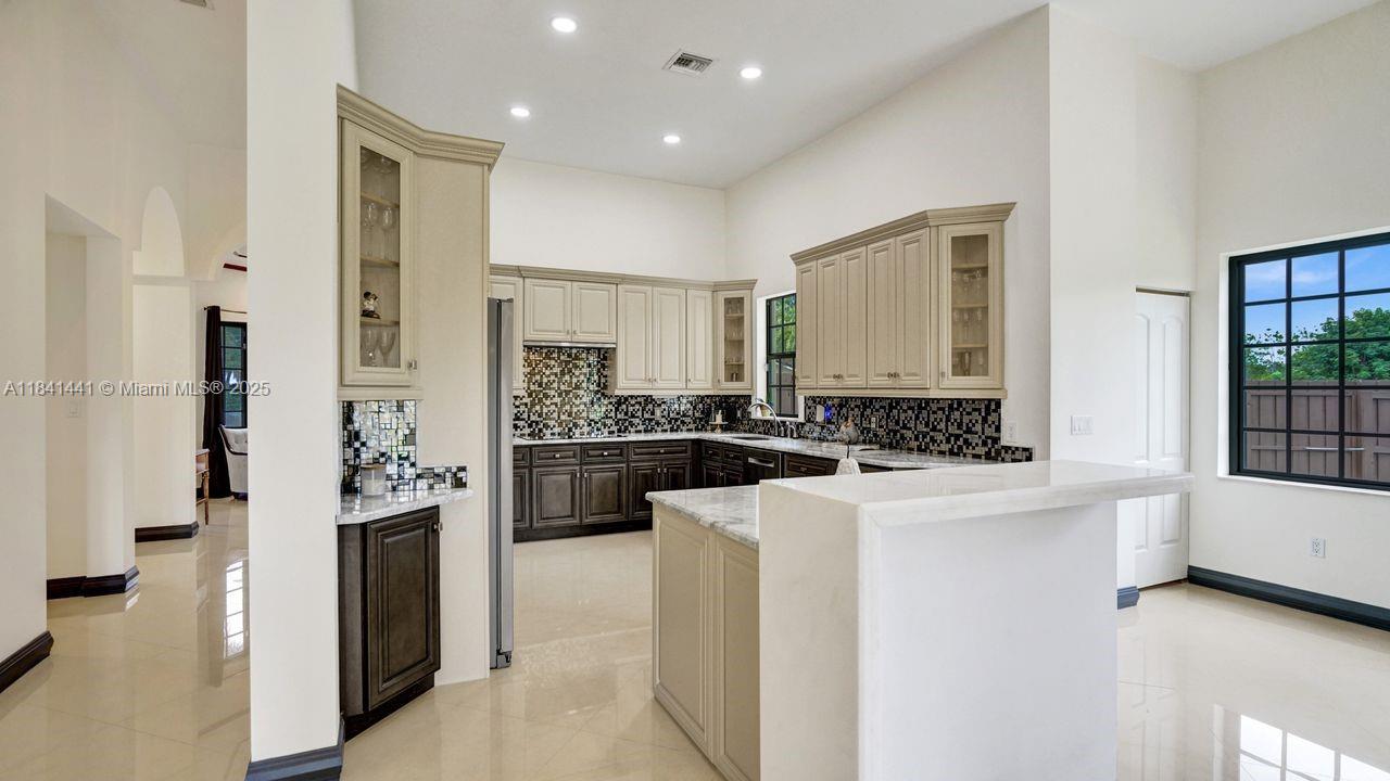 3311 Southwest 118th Terrace Davie, FL 33330 - Photo 17 of 95 a kitchen with a refrigerator and a sink