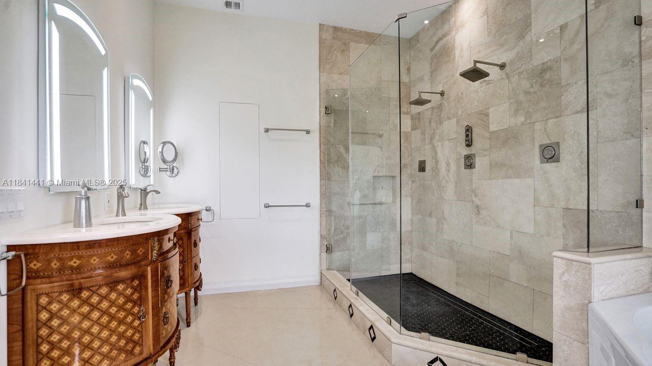 3311 Southwest 118th Terrace Davie, FL 33330 - Photo 33 of 95 a bathroom with a sink a toilet a mirror and shower