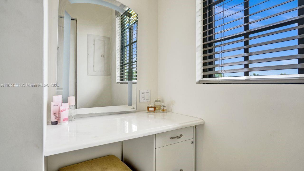3311 Southwest 118th Terrace Davie, FL 33330 - Photo 35 of 95 a bathroom with a sink and a mirror