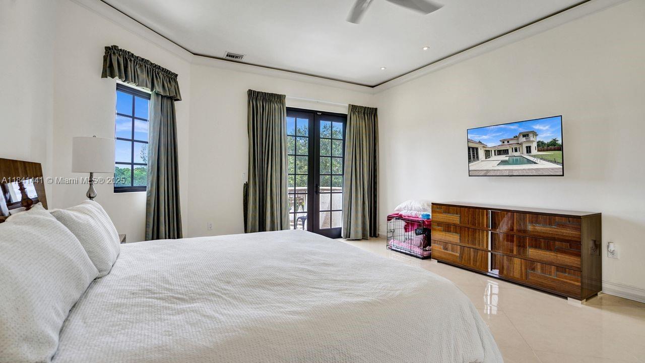 3311 Southwest 118th Terrace Davie, FL 33330 - Photo 37 of 95 a bedroom with a bed dresser and a window