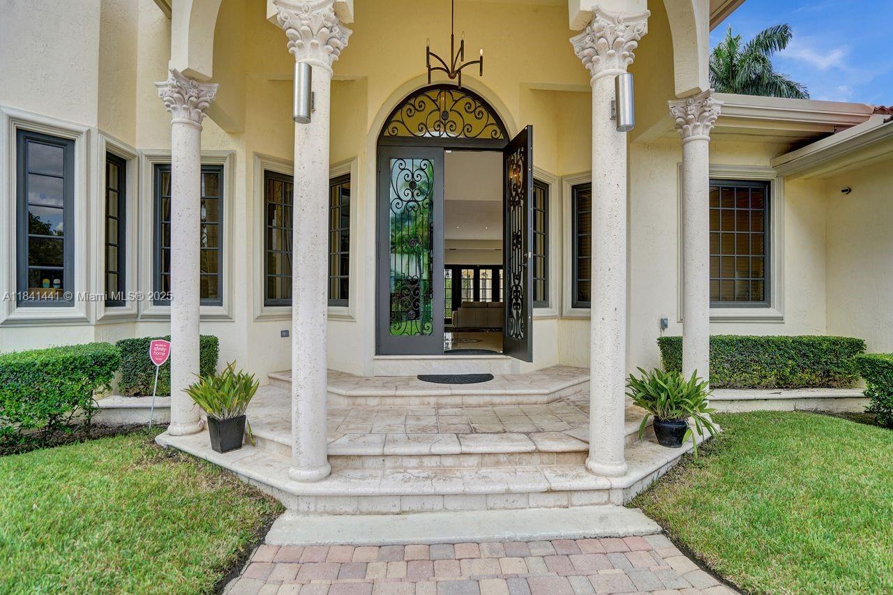 3311 Southwest 118th Terrace Davie, FL 33330 - Photo 4 of 95 a front view of a house with a garden