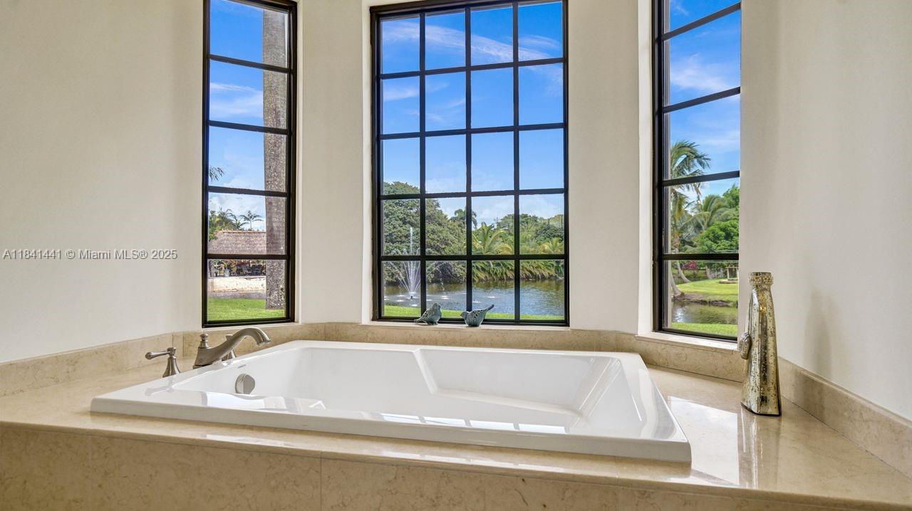 3311 Southwest 118th Terrace Davie, FL 33330 - Photo 48 of 95 a bath tub sitting next to a window