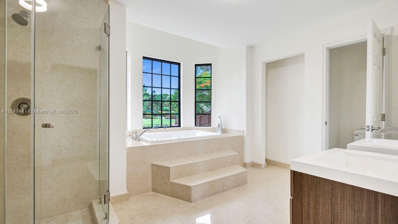 3311 Southwest 118th Terrace Davie, FL 33330 - Photo 49 of 95 a spacious bathroom with a tub shower and sink