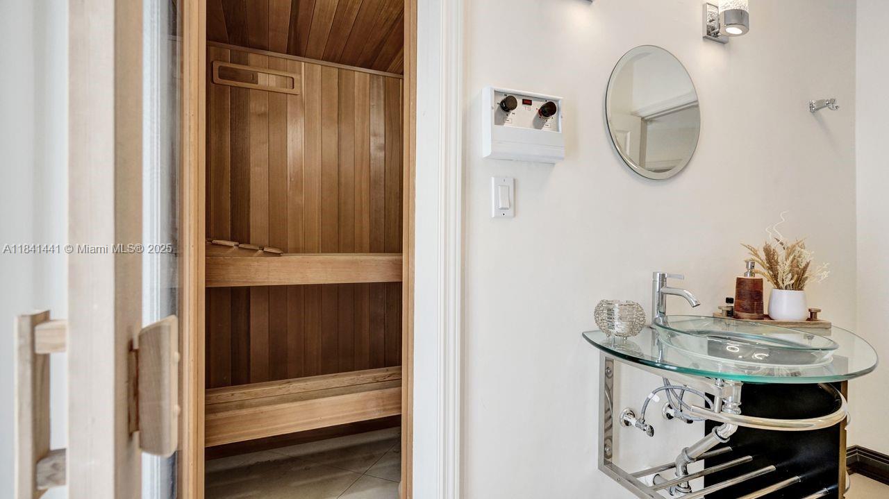 3311 Southwest 118th Terrace Davie, FL 33330 - Photo 52 of 95 a bathroom with a sink and a mirror