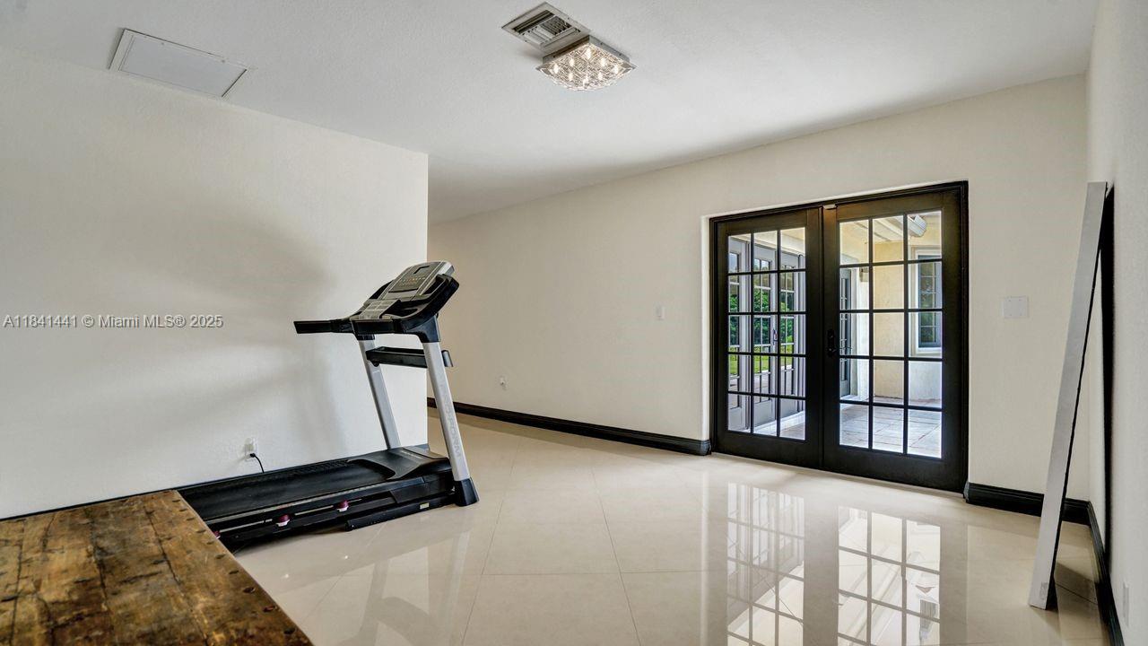 3311 Southwest 118th Terrace Davie, FL 33330 - Photo 55 of 95 a view of a room with gym equipment