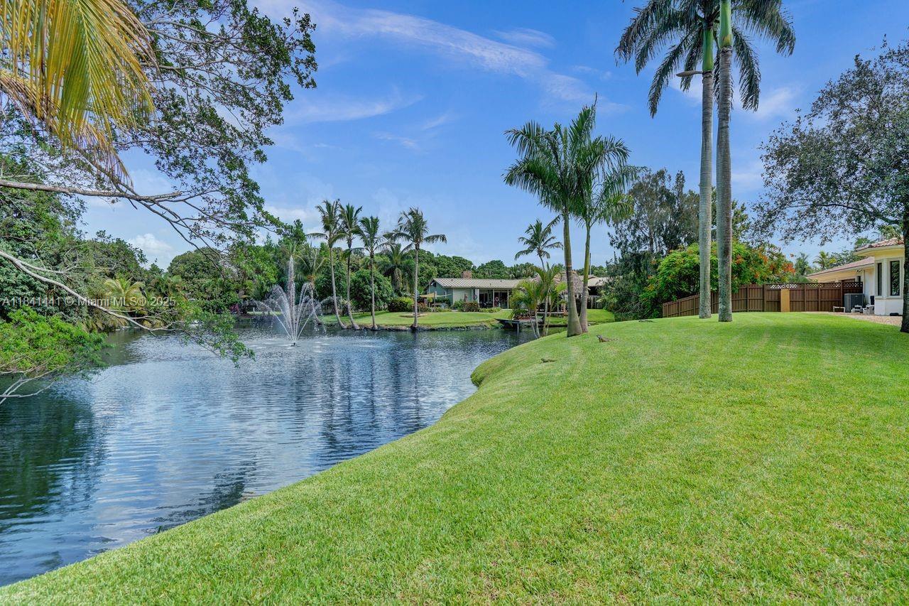 3311 Southwest 118th Terrace Davie, FL 33330 - Photo 66 of 95 a view of a lake with a building in the background