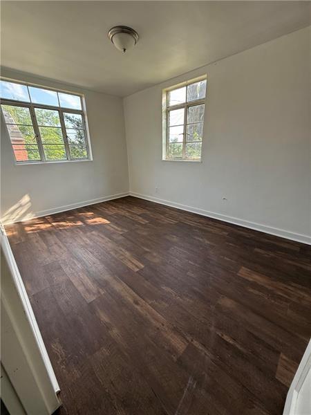 2701 Lincoln Avenue Clairton, PA 15025 - Photo 7 of 10 an empty room with wooden floor and windows