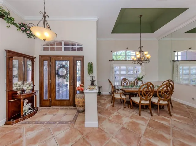 a view of a dining room with furniture window and chandelier