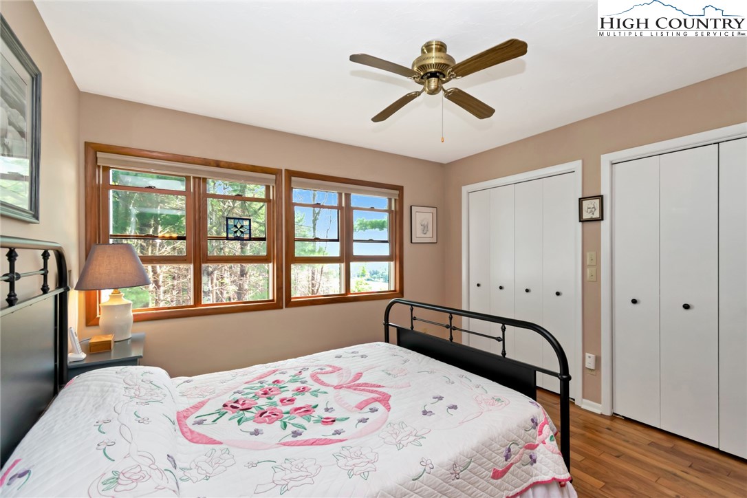 314 Heather Street Boone, NC 28607 - Photo 26 of 50 a bedroom with a bed and a large window
