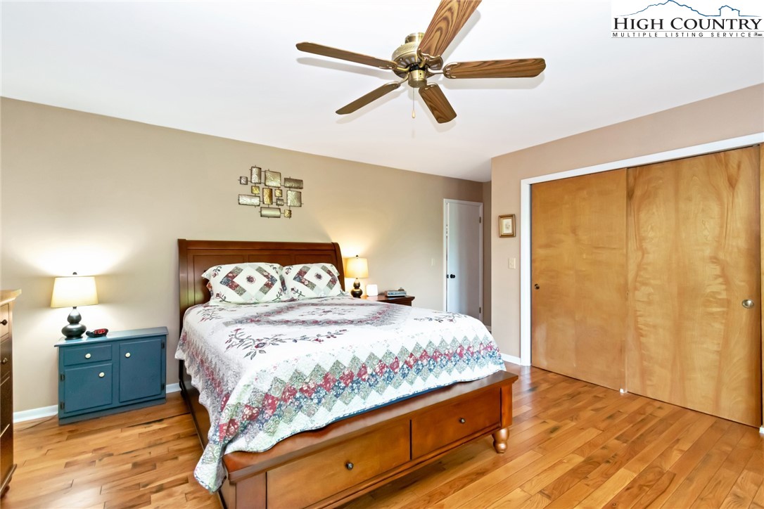 314 Heather Street Boone, NC 28607 - Photo 28 of 50 a bedroom with a bed and a ceiling fan