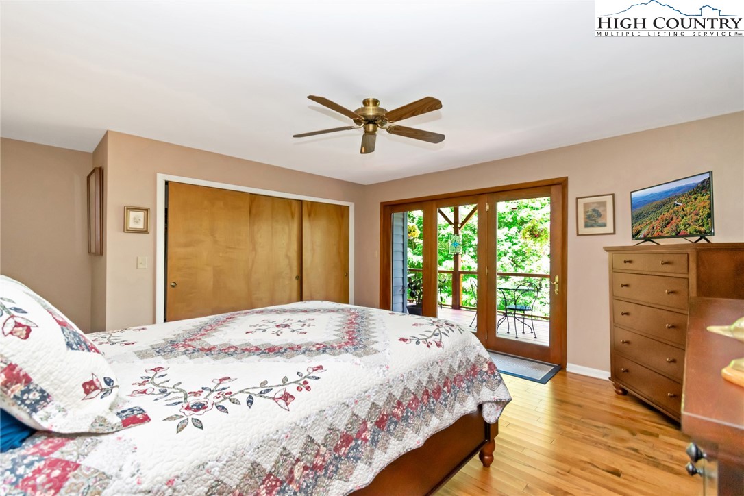 314 Heather Street Boone, NC 28607 - Photo 29 of 50 a bedroom with a large bed and a dresser