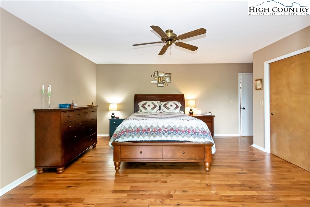 314 Heather Street Boone, NC 28607 - Photo 30 of 50 a bedroom with a bed and wooden floor