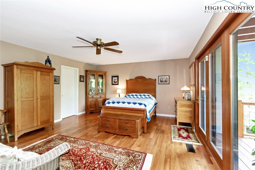 314 Heather Street Boone, NC 28607 - Photo 34 of 50 a living room with a couch and a table with wooden floor