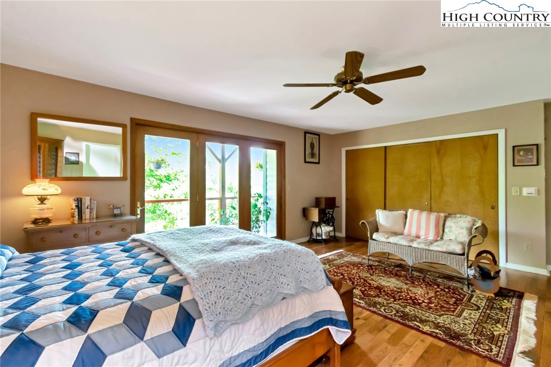 314 Heather Street Boone, NC 28607 - Photo 35 of 50 a bedroom with a bed a couch and a window