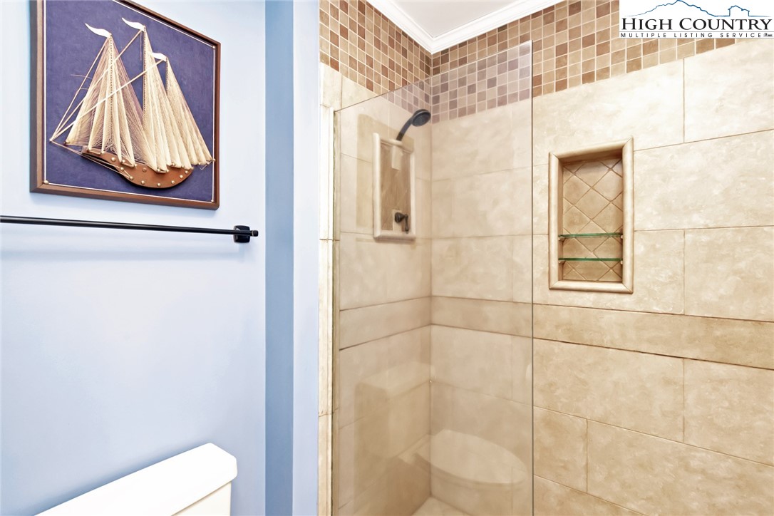 314 Heather Street Boone, NC 28607 - Photo 37 of 50 a bathroom with a window and a shower