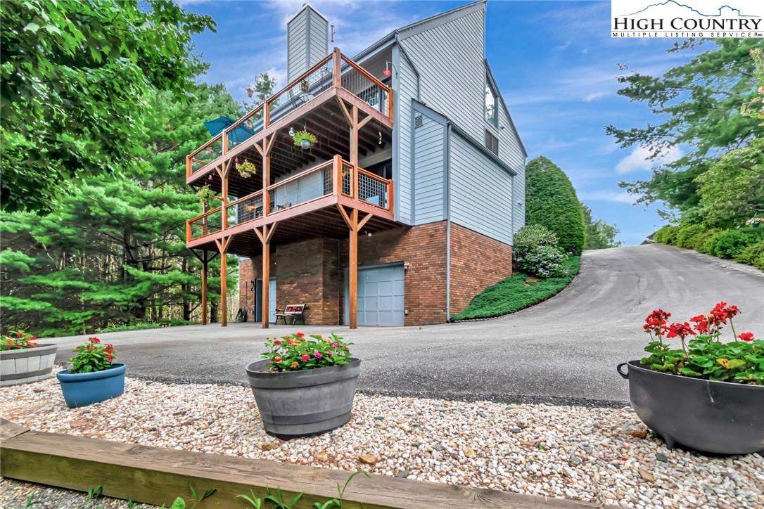 314 Heather Street Boone, NC 28607 - Photo 41 of 50 a front view of a house with potted plants