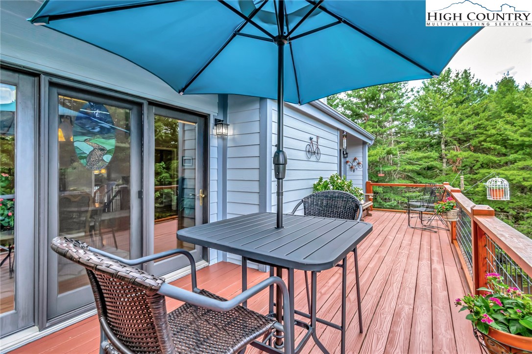 314 Heather Street Boone, NC 28607 - Photo 47 of 50 a patio with wooden floor and outdoor seating