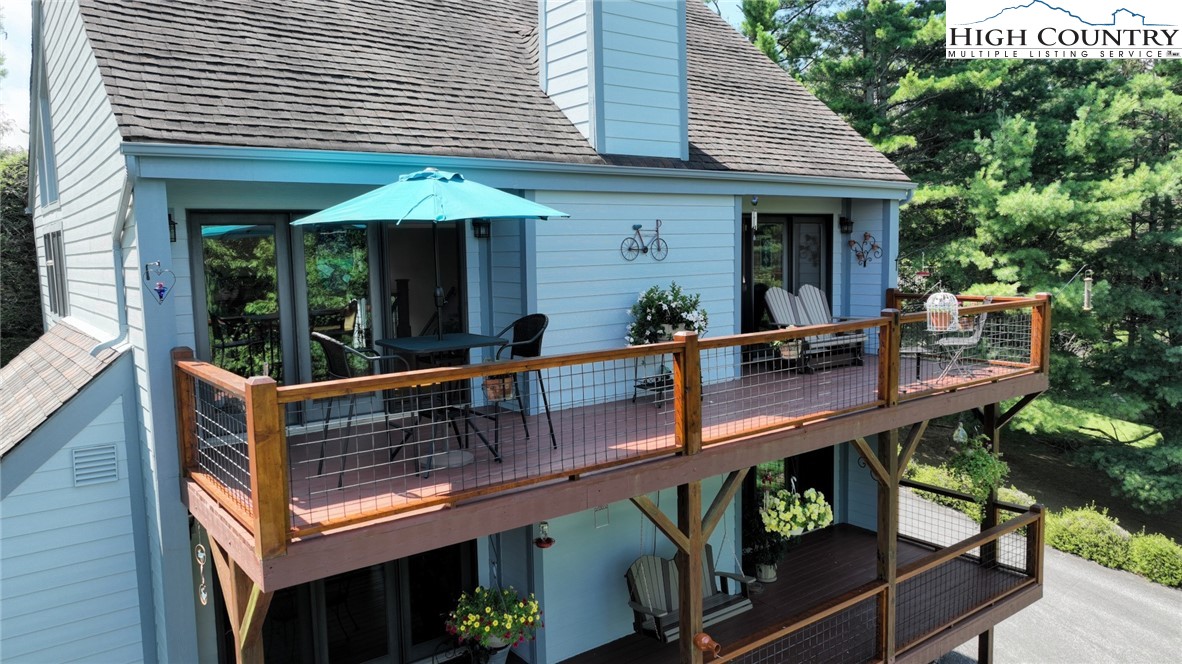 314 Heather Street Boone, NC 28607 - Photo 49 of 50 a view of a chair and tables in the balcony