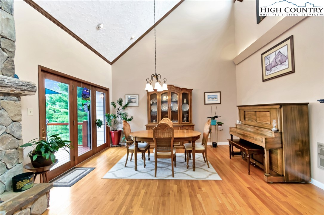 314 Heather Street Boone, NC 28607 - Photo 9 of 50 a dining room with furniture a chandelier and wooden floor