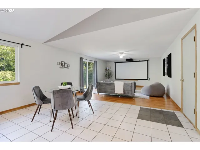 a bedroom with furniture and a rug