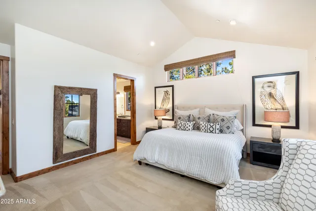 a bathroom with a shower and a glass door