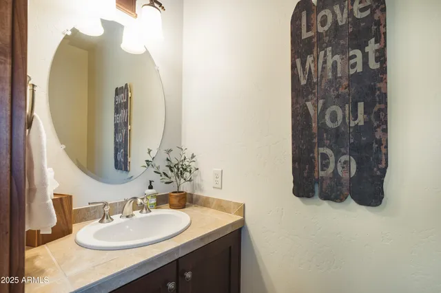 a view of a patio with table and chairs and potted plants
