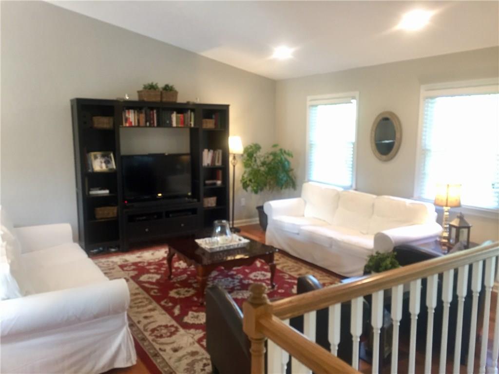 164 Heck Road Sarver, PA 16055 - Photo 3 of 24 Tasteful living room with hardwood floors and Cathedral ceiling!